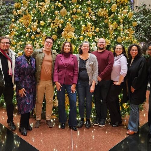 The staff of Atlanta Civic Circle gathers at its annual Christmas dinner in 2025. (Courtesy of Saba Long)