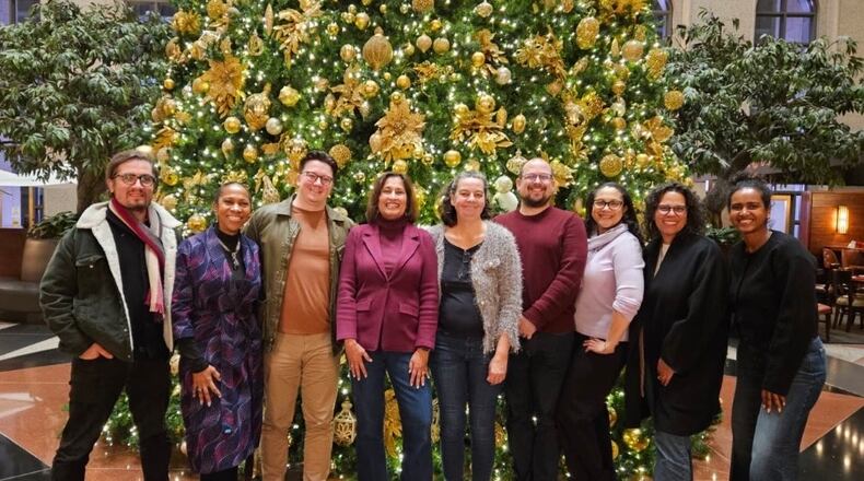 The staff of Atlanta Civic Circle gathers at its annual Christmas dinner in 2025. (Courtesy of Saba Long)
