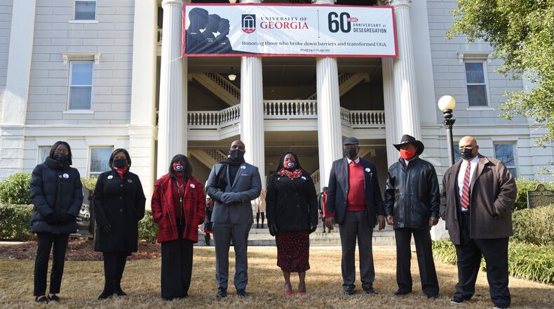Eight people who rang the Chapel Bell (from left) Autumn Pressley, Yvette Daniels, Ericka Davis, Jeff Brown, Shontel Cargill, Ken Dious, Horace King and Hamilton Holmes Jr. pose for a group photograph outside the Holmes-Hunter Academic Building on the campus in Athens on Saturday, January 9, 2021. On January 9, 1961, two courageous students, Hamilton Holmes and Charlayne Hunter, took heroic steps on the University of GeorgiaÕs campus to enroll as students followed by Mary Frances Early, who entered graduate school that summer. Their legacies continue as they have contributed a lifetime of public service to their communities. Because of these students, the university now boasts a diverse campus made of numerous nationalities, races and ethnicities. (Hyosub Shin / Hyosub.Shin@ajc.com)