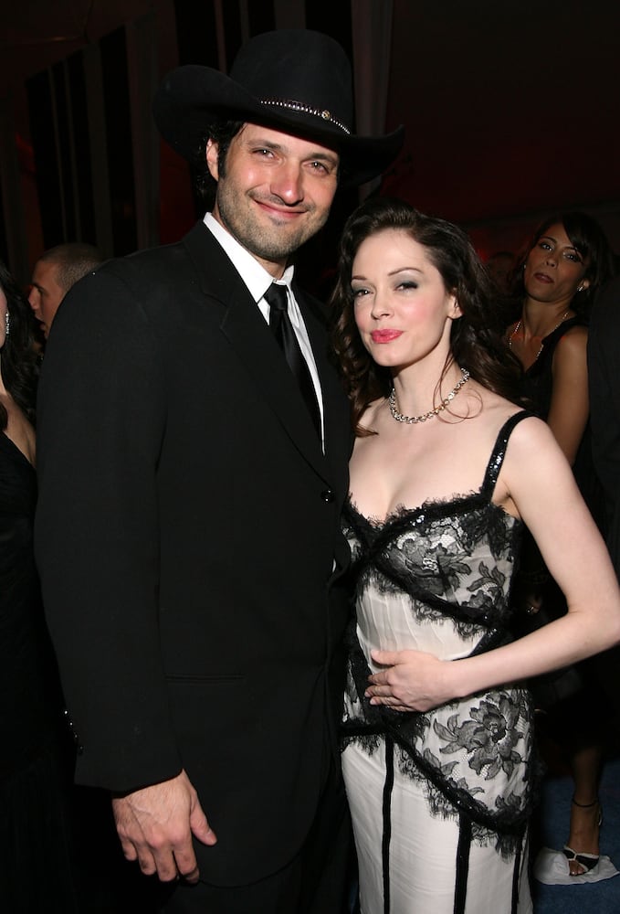 Director Robert Rodriguez and actress Rose McGowan get photobombed