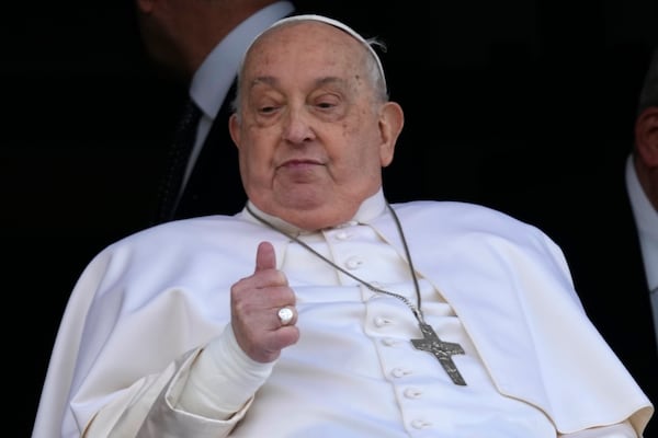 FILE - Pope Francis gives the thumbs up as he appears at a window of the Agostino Gemelli Polyclinic in Rome, Sunday, March 23, 2025, where he has been treated for bronchitis and bilateral pneumonia since Feb. 14. (AP Photo/Domenico Stinellis, File)