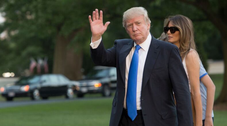 WASHINGTON, D.C. - JUNE 11: (AFP-OUT) U.S. President Donald Trump, first lady Melania Trump and their son Barron Trump arrive at the White House June 11, 2017 in Washington, DC. According to reports, Melania and Barron will soon be moving from Trump Tower in New York City to the White House. (Photo by Chris Kleponis-Pool/Getty Images)