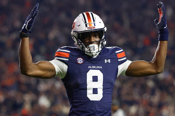 FILE - Auburn wide receiver Cam Coleman reacts after a touchdown during the second half of an NCAA college football game against Texas A&M, Saturday, Nov. 23, 2024, in Auburn, Ala. (AP Photo/Butch Dill, File)