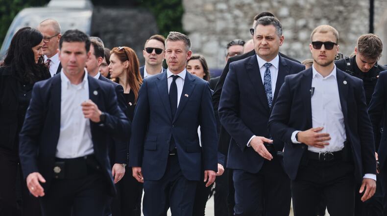 Hungarian Prime Minister Peter Magyar, center, arrives at the Wawel Cathedral during his visit in Krakow, Poland Tuesday, May 19, 2026. (AP Photo/Beata Zawrzel)