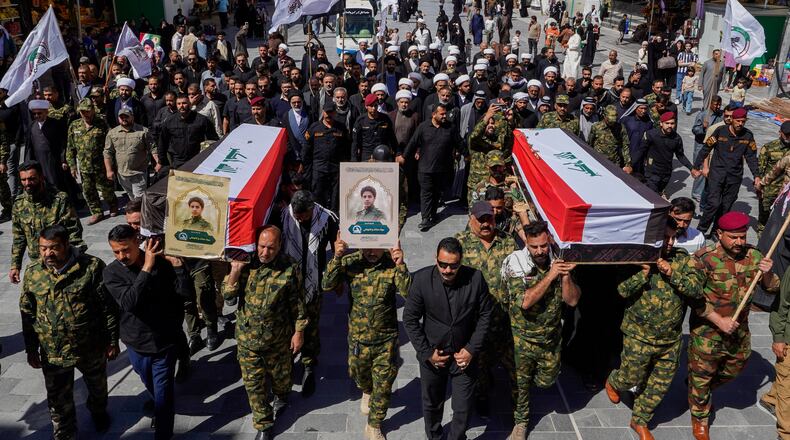 FILE - Members of the Popular Mobilization Forces attend a funeral for colleagues who were killed in a U.S. airstrike in Anbar, in Najaf, Iraq, Wednesday, April 1, 2026. (AP Photo/Anmar Khalil, File)