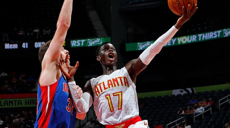 Dennis Schroder of the Hawks drives against Jon Leuer of the Pistons at Philips Arena on October 13, 2016 in Atlanta, Georgia. (Photo by Kevin C. Cox/Getty Images)