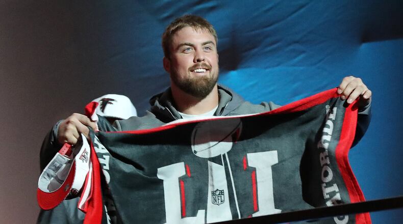 January 30, 2017, Houston: Falcons guard Ben Garland flashes a Super Bowl towel as he takes the stage for Super Bowl Opening Night on Monday, Jan. 30, 2017, at Minute Maid Park in Houston. Curtis Compton/ccompton@ajc.com