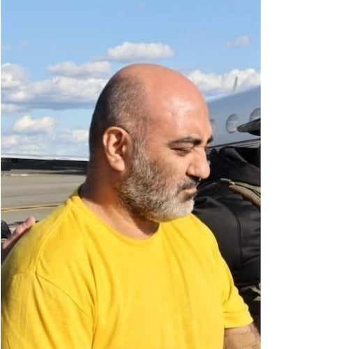 This photo provided by the U.S. Department of Justice shows Iranian citizen Reza Dindar at King County International Airport, in Seattle, Thursday, April 16, 2026, after being extradited from Panama to face charges that he conspired to violate U.S. trade sanctions against Iran. (U.S. Department of Justice via AP)