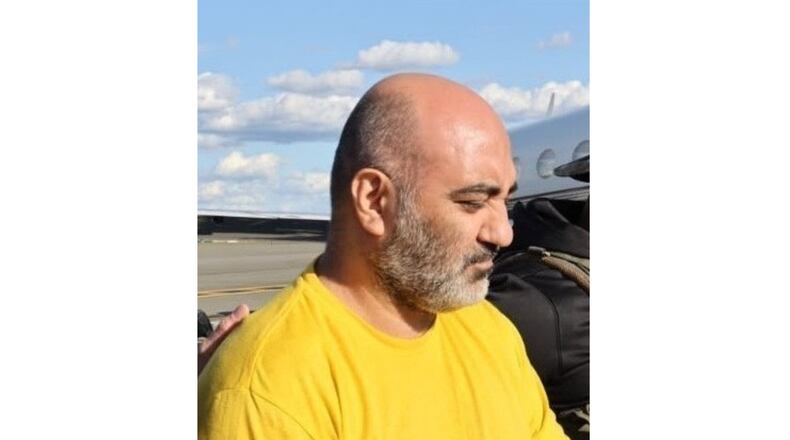 This photo provided by the U.S. Department of Justice shows Iranian citizen Reza Dindar at King County International Airport, in Seattle, Thursday, April 16, 2026, after being extradited from Panama to face charges that he conspired to violate U.S. trade sanctions against Iran. (U.S. Department of Justice via AP)