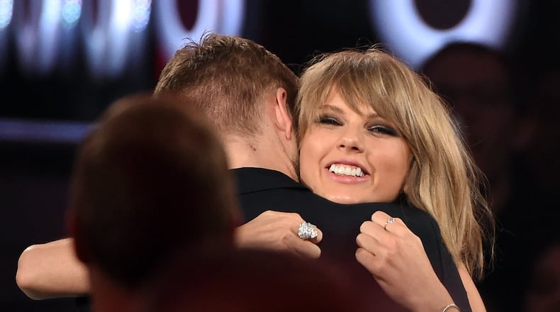 LAS VEGAS, NV - MAY 17: Recording artist Taylor Swift embraces DJ/producer Calvin Harris after she won the Top Billboard 200 Album award during the 2015 Billboard Music Awards at MGM Grand Garden Arena on May 17, 2015 in Las Vegas, Nevada. (Photo by Ethan Miller/Getty Images)