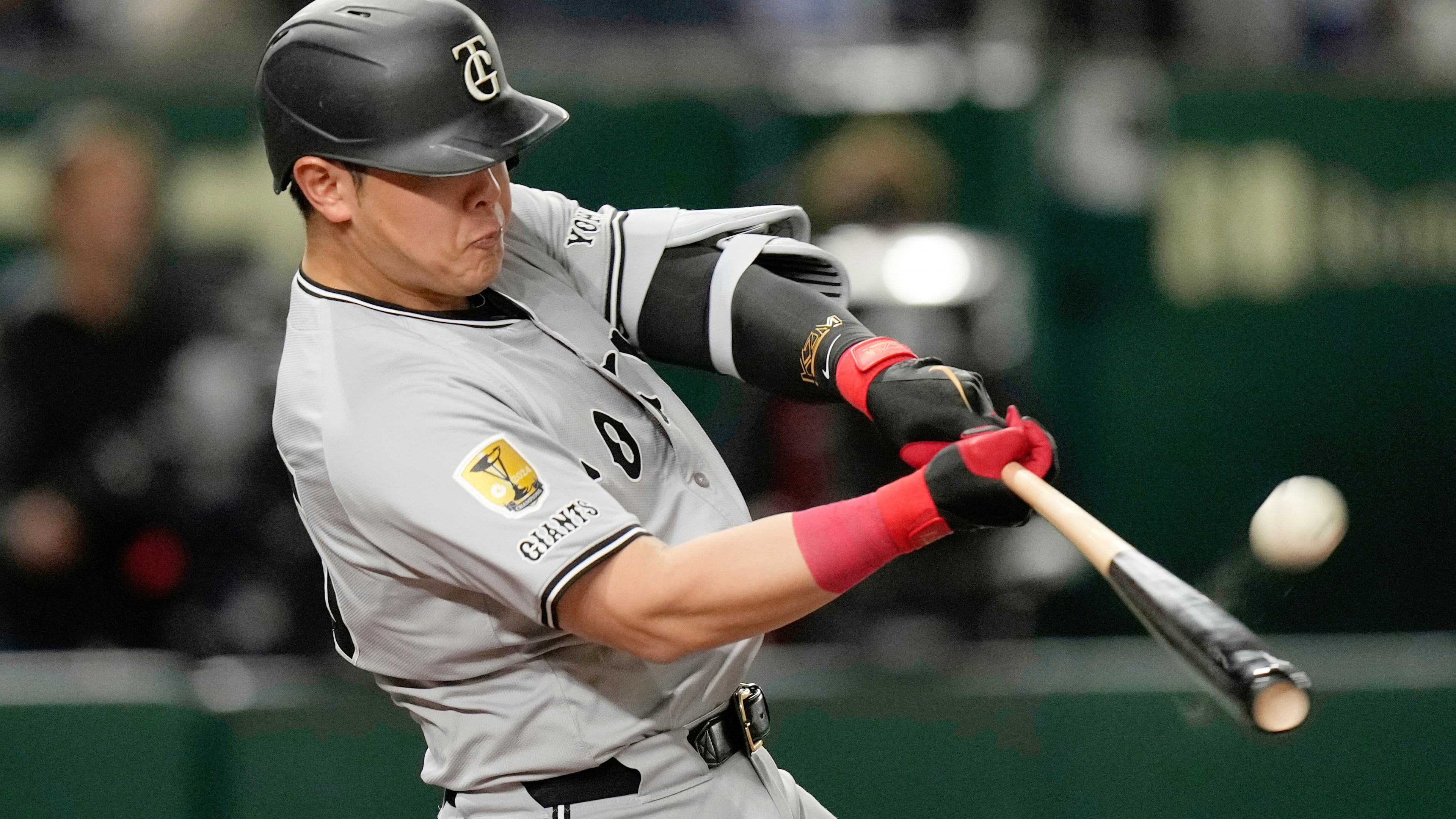 FILE - Yomiuri Giants' Kazuma Okamoto flies out in the fourth inning of a spring training baseball game against the Los Angeles Dodgers in Tokyo, Japan, Saturday, March 15, 2025. (AP Photo/Hiro Komae, File)
