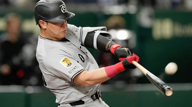 FILE - Yomiuri Giants' Kazuma Okamoto flies out in the fourth inning of a spring training baseball game against the Los Angeles Dodgers in Tokyo, Japan, Saturday, March 15, 2025. (AP Photo/Hiro Komae, File)