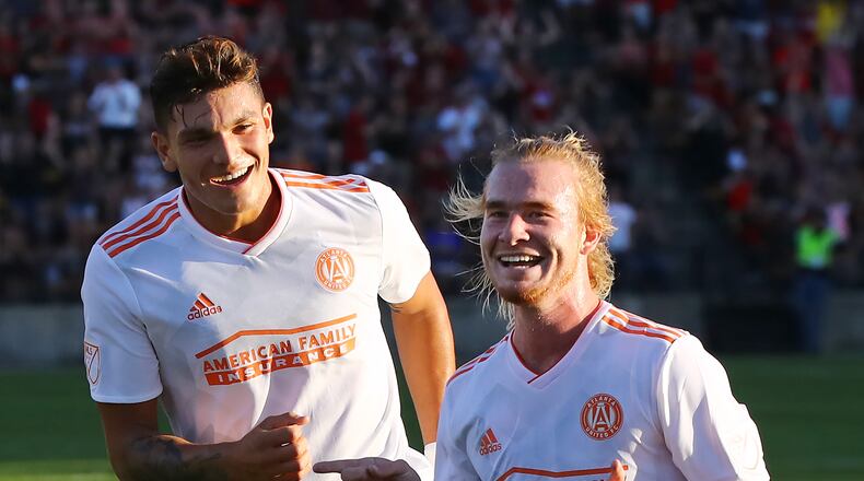 June 6, 2018 Kennesaw: Atlanta United midfielder Andrew Carleton (right) celebrates his goal against Charleston Battery with teammate Brandon Vazquez for a 1-0 lead during the first half in a U.S. Open Cup match on Wednesday, June 6, 2018, in Kennesaw. Curtis Compton/ccompton@ajc.com