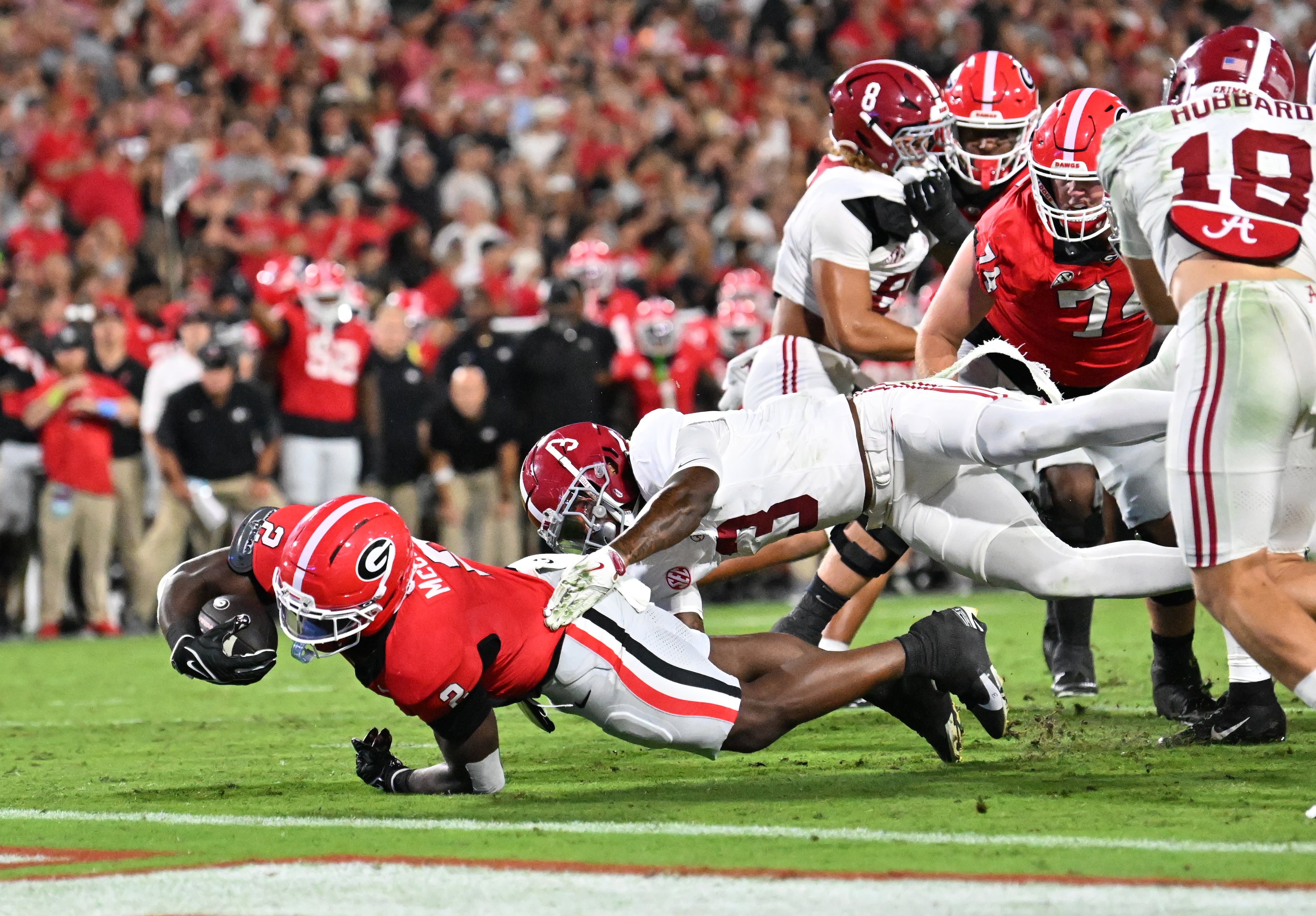 Georgia running back Josh McCray (2) falls past Alabama defensive back Keon Sabb (3) for yardage during the second half in an NCAA football game at Sanford Stadium, Saturday, September 27, 2025, in Athens. Alabama won 24-21 over Georgia. (Hyosub Shin / AJC)