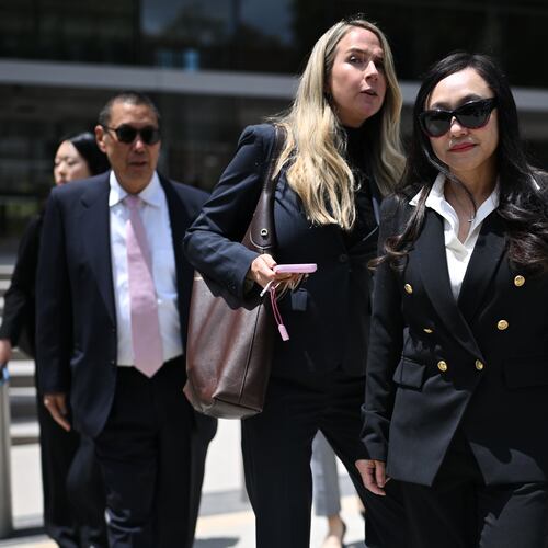 Eileen Wang, the former mayor of Arcadia, Calif., at right, exits federal court after pleading guilty on charges of acting as an illegal agent for the Chinese government on Friday, May 29, 2026, in Los Angeles. (AP Photo/William Liang)