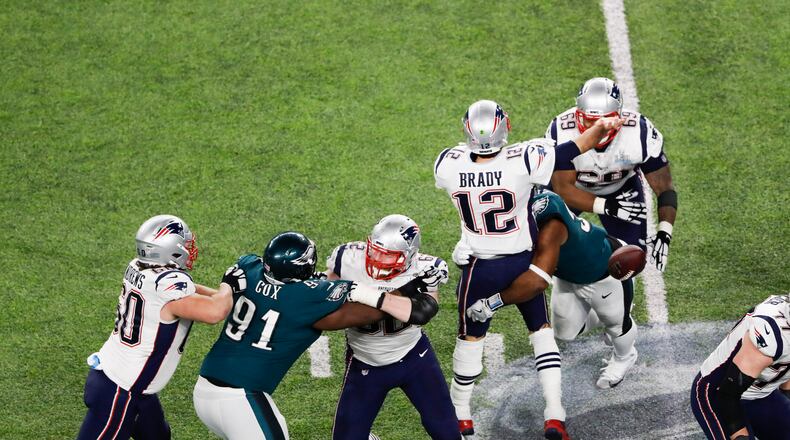 New England quarterback Tom Brady fumbles in the fourth quarter after being hit by Philadelphia’s Brandon Graham at U.S. Bank Stadium in Minneapolis. The fumble led to a field goal and a clinching field goal in the Eagles’ win.