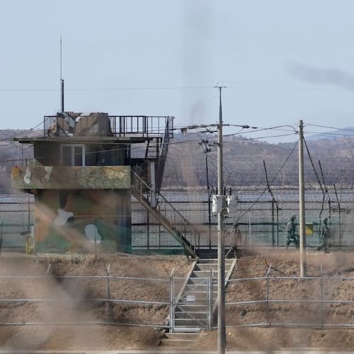 FILE - South Korean army soldiers patrol along the barbed-wire fence in Paju, South Korea, near the border with North Korea, on Feb. 18, 2025. (AP Photo/Ahn Young-joon, File)