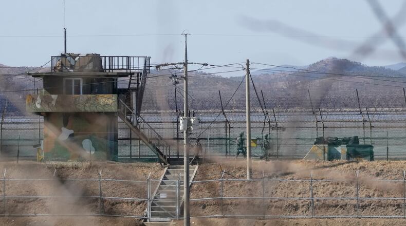 FILE - South Korean army soldiers patrol along the barbed-wire fence in Paju, South Korea, near the border with North Korea, on Feb. 18, 2025. (AP Photo/Ahn Young-joon, File)