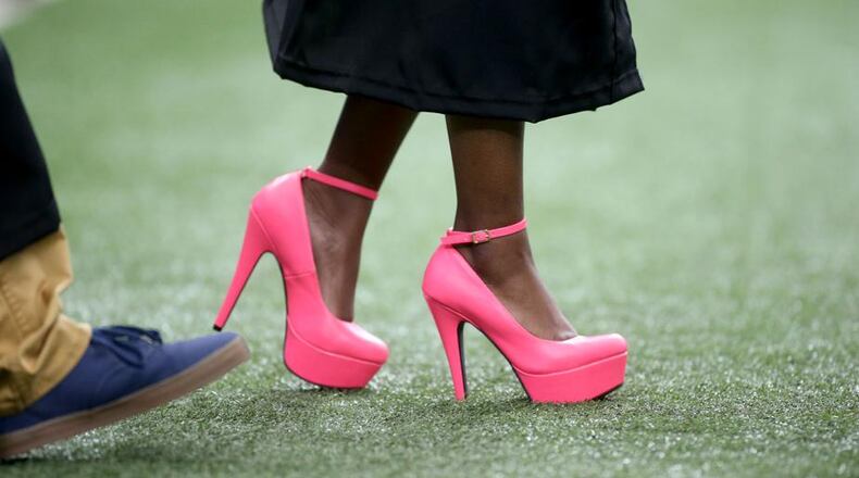 Fayette County wants to protect its turf fields from punctures caused by sharp heels. AJC file photo