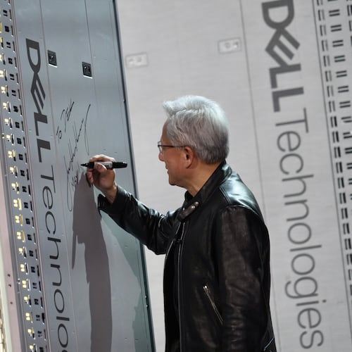CEO of NVIDIA Jensen Huang signs a DELL machine at Dell Technologies World event happing in Las Vegas on Monday, May 18, 2026 (AP Phot/Ty ONeil)