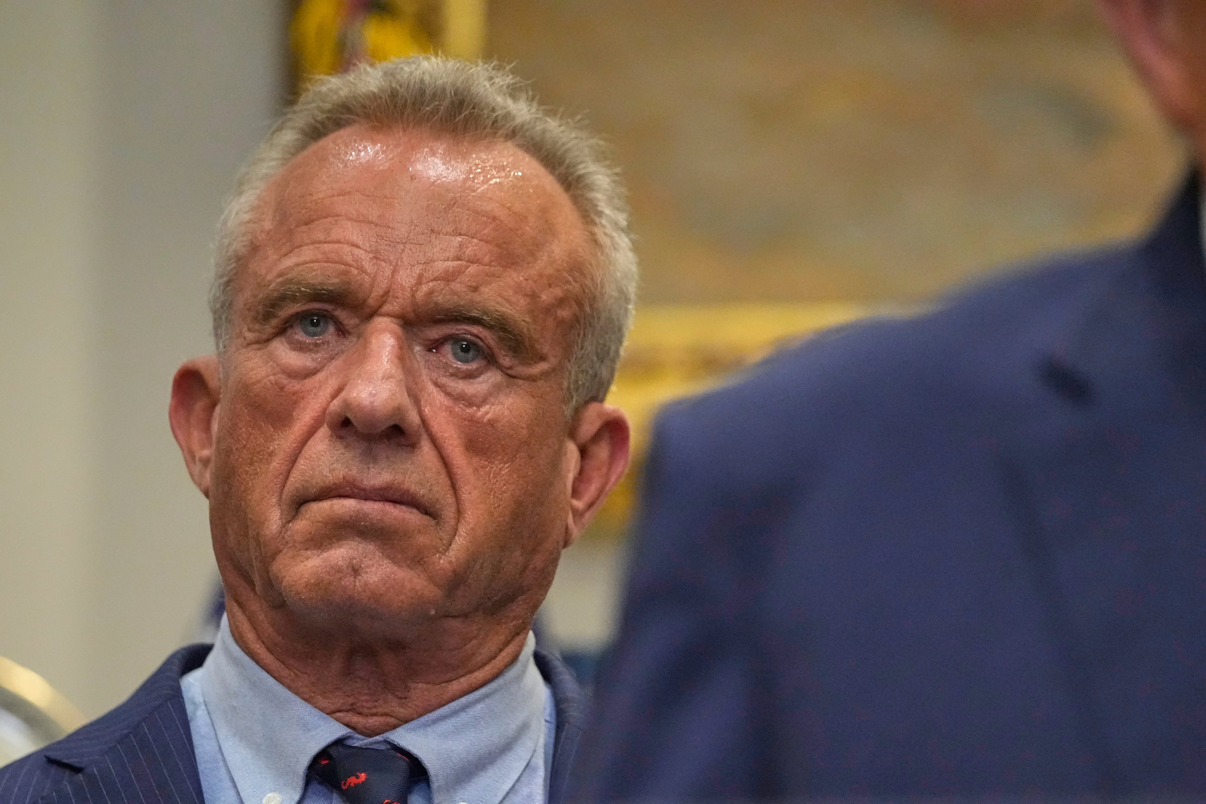 Health and Human Services Secretary Robert F. Kennedy Jr. listens as President Donald Trump speaks in the Roosevelt Room of the White House, Monday, Sept. 22, 2025, in Washington. (Mark Schiefelbein/AP)