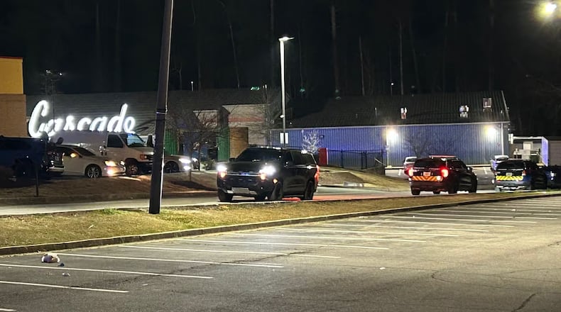 A woman was injured and a man is in jail after a shooting at the Cascade Family Skating Rink in southwest Atlanta on Sunday night.