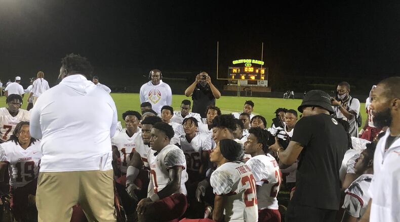 Maurice Dixon addresses his Creekside football team after their 19-14 win at Grayson on Aug. 20, 2021.