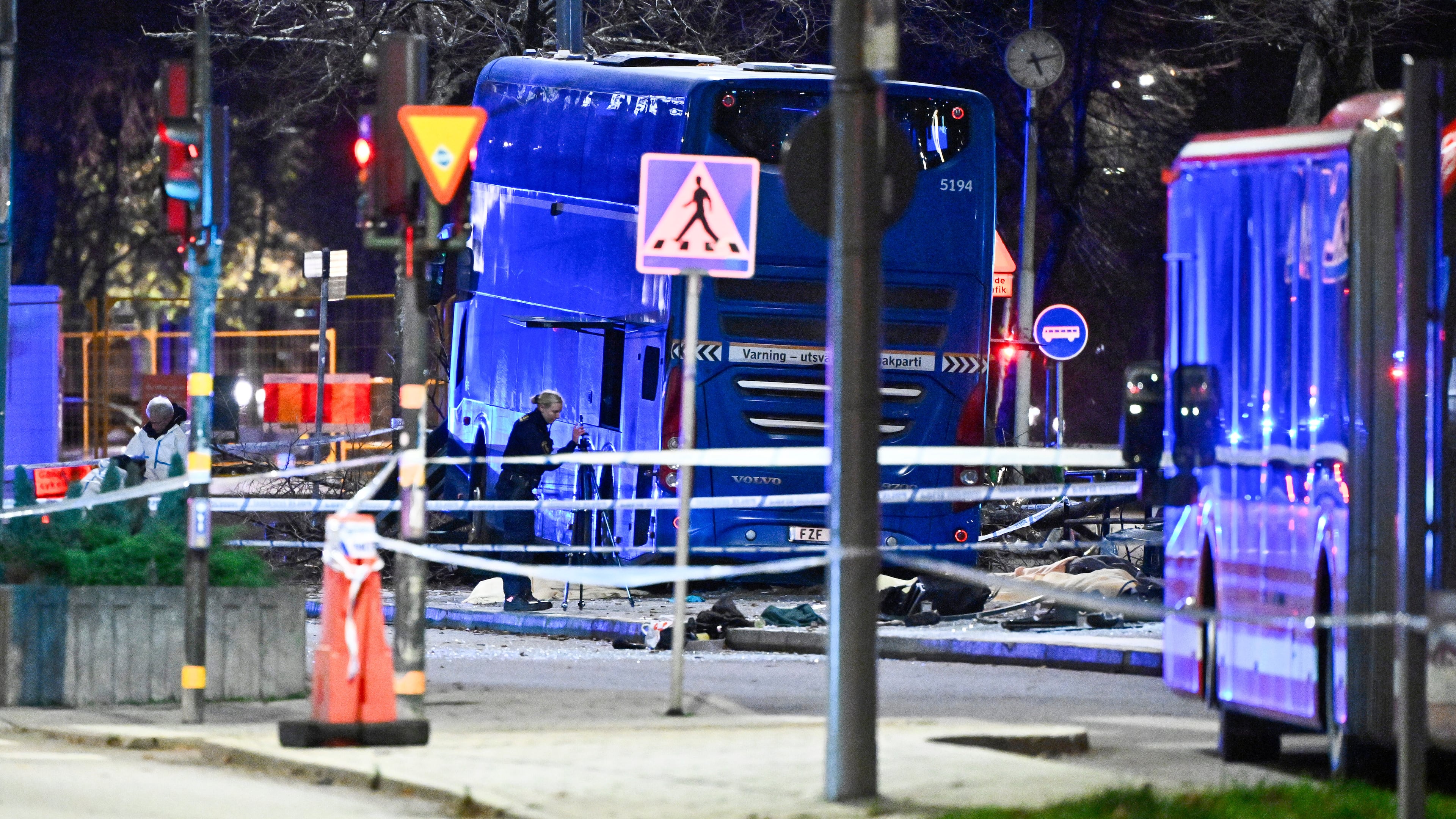 A double-decker bus crashed into a bus shelter in Stockholm on Friday, Nov. 14, 2025, causing fatalities and injuries. (Claudio Bresciani/TT News Agency via AP)