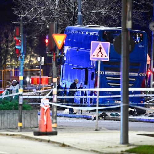 A double-decker bus crashed into a bus shelter in Stockholm on Friday, Nov. 14, 2025, causing fatalities and injuries. (Claudio Bresciani/TT News Agency via AP)