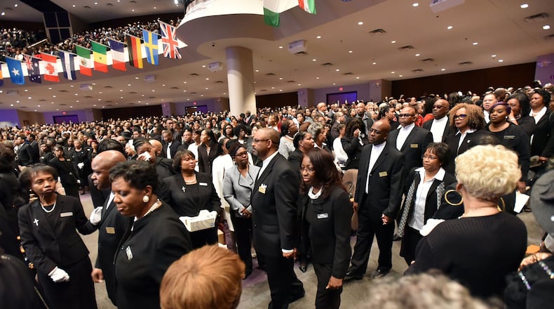 Mourners fill the sanctuary as the processional comes into the church during the homegoing services for Bishop Eddie Long, senior pastor at New Birth Missionary Baptist Church, on Wednesday, Jan. 25, 2017. HYOSUB SHIN / HSHIN@AJC.COM