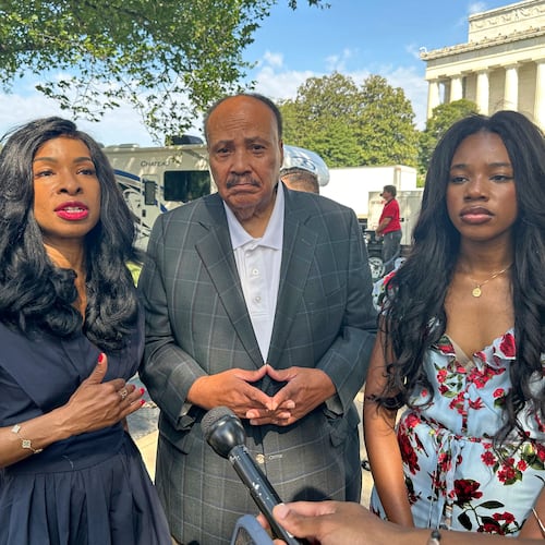 Arndrea Waters King, from left, Martin Luther King III and their daughter Yolanda Renee King participate in an interview before the March on Washington, Friday, Aug. 28, 2026, near the Lincoln Memorial in Washington. (AP Photo/Nathan Ellgren)