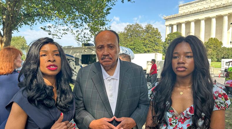 Arndrea Waters King, from left, Martin Luther King III and their daughter Yolanda Renee King participate in an interview before the March on Washington, Friday, Aug. 28, 2026, near the Lincoln Memorial in Washington. (AP Photo/Nathan Ellgren)