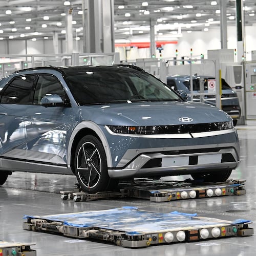 Electric vehicles are transported by autonomous mobile robots through the assembly line at the Hyundai Motor Group Metaplant America on Wednesday, May 6, 2026, in Ellabell. The Korean auto giant is evaluating plans to increase the annual production capacity at its plant near Savannah. (Hyosub Shin/AJC)