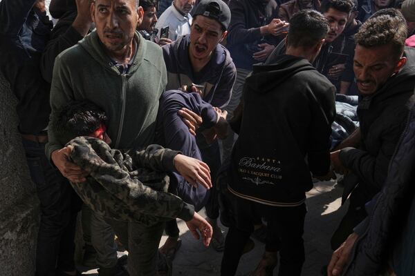 Palestinians injured in an Israeli airstrike are brought to the Baptist Hospital in Gaza City, Saturday, April 12, 2025. (AP Photo/Jehad Alshrafi)