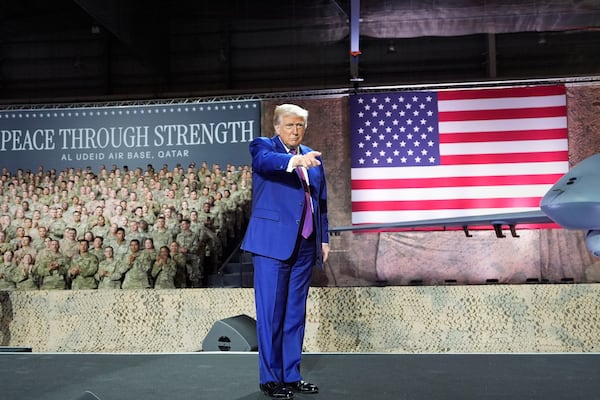 President Donald Trump gestures on stage at the Al Udeid Air Base, Thursday, May 15, 2025, in Doha, Qatar. (AP Photo/Alex Brandon)