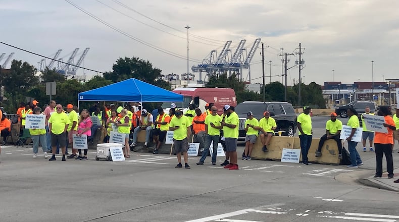 Union dockworkers picket at the main gate at the Georgia Ports Authority's Garden City Terminal in Savannah during a three-day strike staged in October 2024. (Adam Van Brimmer/AJC)
