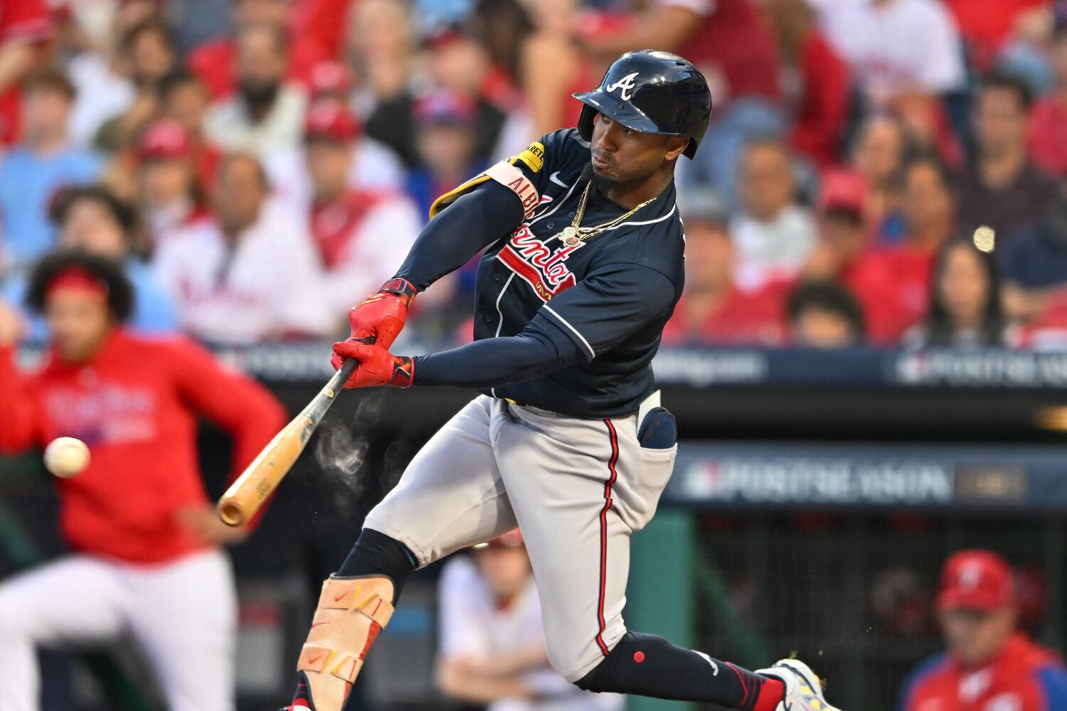 Atlanta Braves’ Ozzie Albies (1) hits an RBI single against the Philadelphia Phillies that scores Ronald Acuna Jr. during the third inning of NLDS Game 3 in Philadelphia on Wednesday, Oct. 11, 2023.   (Hyosub Shin / Hyosub.Shin@ajc.com)