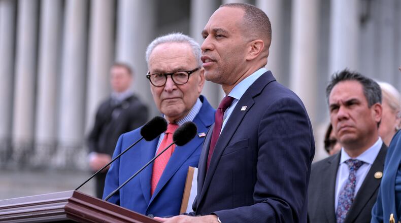 House Minority Leader Hakeem Jeffries, D-N.Y., center, speaks as Senate Minority Leader Chuck Schumer, D-N.Y., left, Vice Chair Rep. Pete Aguilar, D-Calif., right, listen during a news conference, Thursday, May 21, 2026, on Capitol Hill, in Washington. (AP Photo/Mariam Zuhaib)
