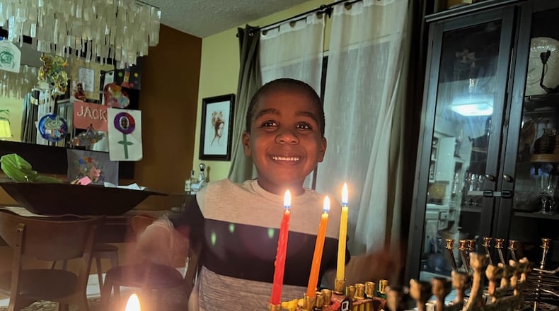 Jack Kulbersh lights a menorah during Hanukkah. His father, Adam Kulbersh, co-founded Project Menorah, which encourages allies of Jews around the world to express solidarity in the face of anti-semitism. Photo: Adam Kulbersh