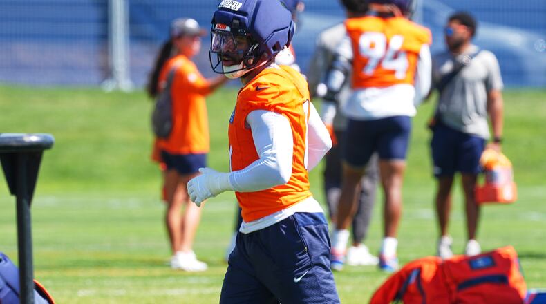 Denver Broncos linebacker Jonathon Cooper takes part in drills during a practice at the team's NFL football training camp, Wednesday, July 29, 2026, in Centennial, Colo. (AP Photo/David Zalubowski)