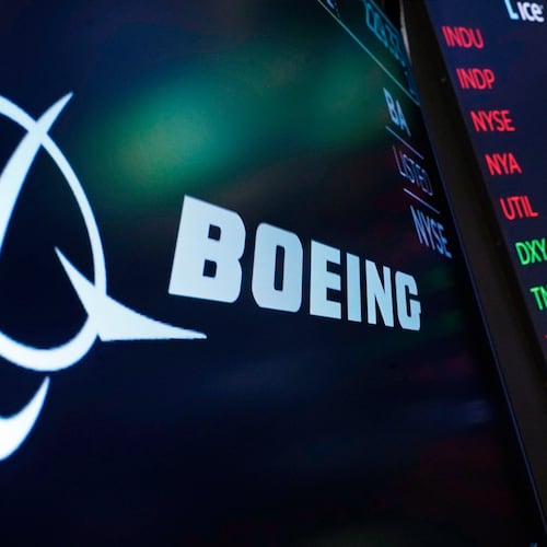FILE - The logo for Boeing appears on a screen above a trading post on the floor of the New York Stock Exchange, July 13, 2021. (AP Photo/Richard Drew, File)