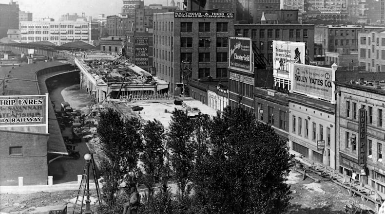 Construction of the Spring Street viaduct sometime around 1920, one of the major projects for a growing Atlanta, meant that older infrastructure such as existing water mains needed replacing. (File)