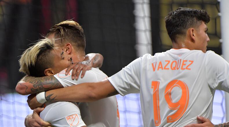 July 21, 2018 - Atlanta United forward Josef Martinez (7) is congratulated by teammates after his 6th career MLS hat trick during the second half in a MLS soccer game at Mercedes-Benz Stadium on Saturday, July 21, 2018. Three more goals from Josef Martinez set a new MLS record lifted Atlanta United to a 3-1 victory over D.C. United on Saturday at Mercedes-Benz Stadium. HYOSUB SHIN / HSHIN@AJC.COM