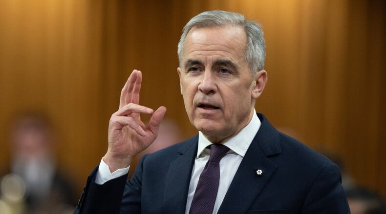 Canadian Prime Minister Mark Carney rises during Question Period, on Parliament Hill in Ottawa, Monday, Nov. 17, 2025. (Adrian Wyld/The Canadian Press via AP)