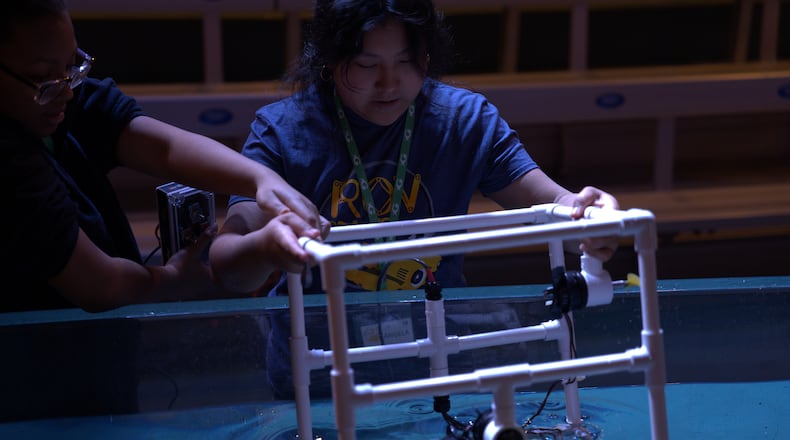 STEAM students from Gwinnett County's Sweetwater Middle School work on underwater remote-operated vehicles as part of a spring break program at the Georgia Aquarium. (Courtesy of Georgia Aquarium)