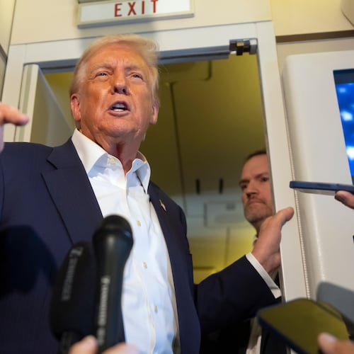 President Donald Trump speaks to reporters aboard Air Force One while traveling from Kuala Lumpur, Malaysia, to Tokyo, Japan, Monday, Oct. 27, 2025. (AP Photo/Mark Schiefelbein)