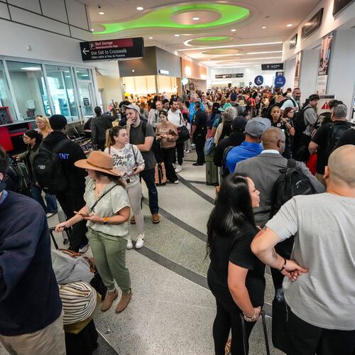 Airline passengers wait in long lines to get through the TSA security screening at William P. Hobby Airport in Houston, Sunday, March 8, 2026. (Brett Coomer/Houston Chronicle via AP)