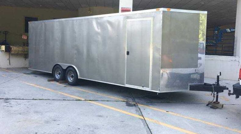 Police in Sandy Springs are searching for suspects who stole two trailers carrying $22,000 worth of mixed-martial arts equipment.