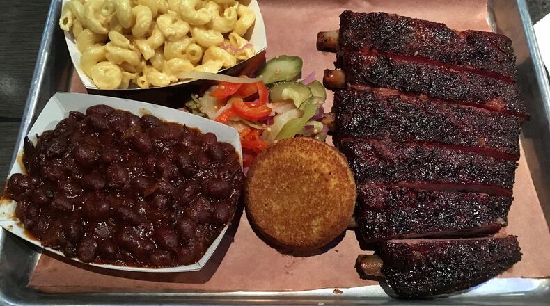 A plate of St. Louis cut ribs, pit beans, and mac and cheese at Loyal Q. CONTRIBUTED BY WYATT WILLIAMS