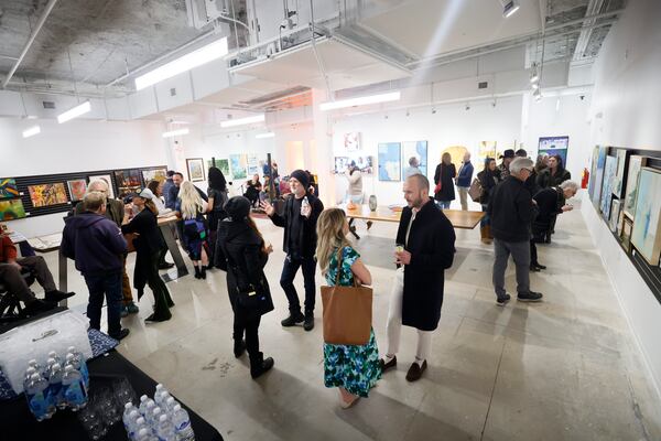 The “Love Asheville from Afar” exhibit celebrates the resiliency and varied creative expressions of the River Arts District. Works include a strong collection of paintings, jewelry and crafts. (Miguel Martinez/AJC)